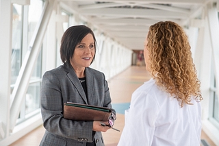 An MSN nurse speaks with a hospital administrator